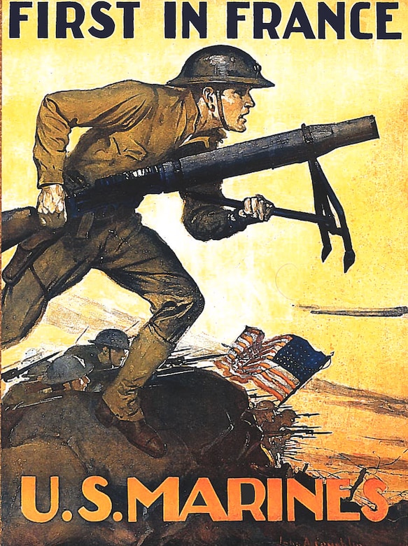 Marines wielding guns charge into battle as a U.S. flag flutters in the distance.