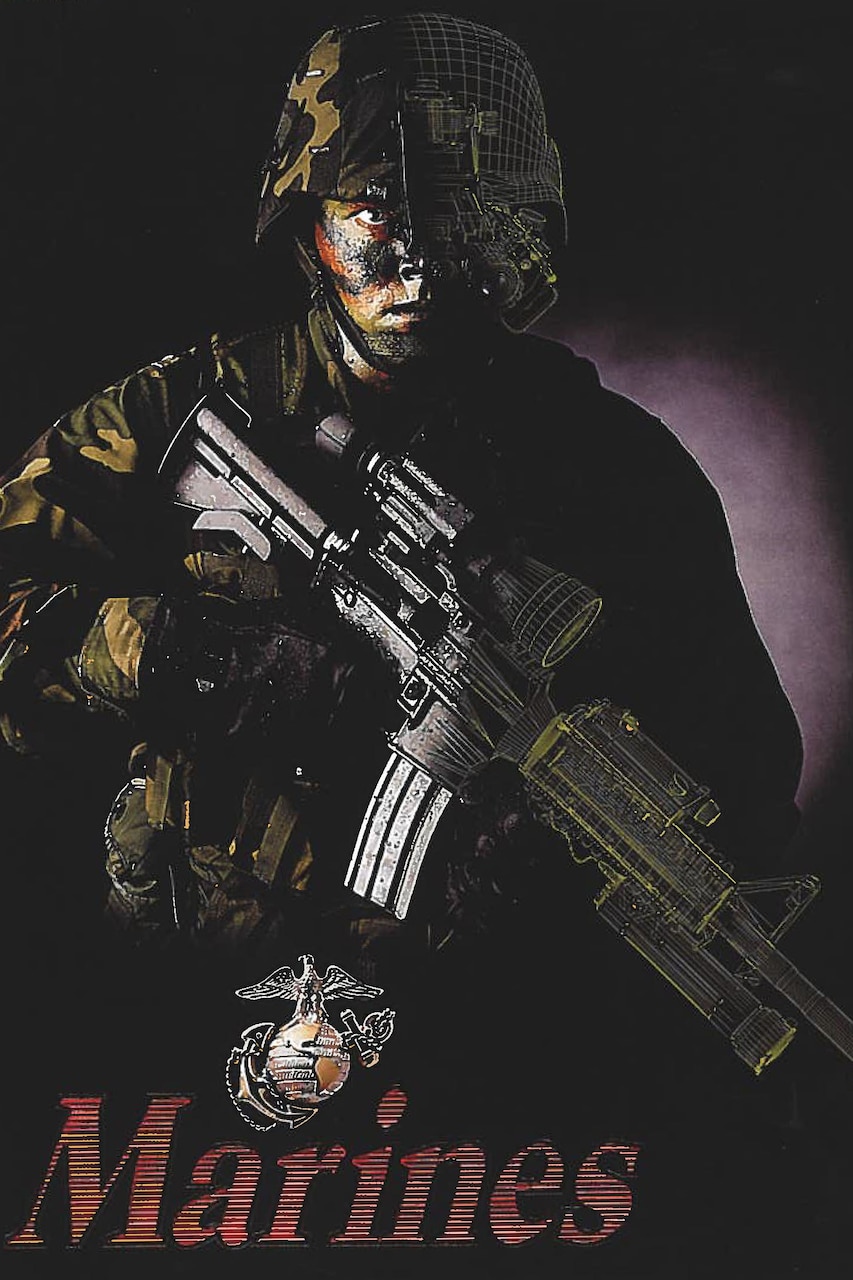 A Marine with a carbine and night vision goggles is shown at night.