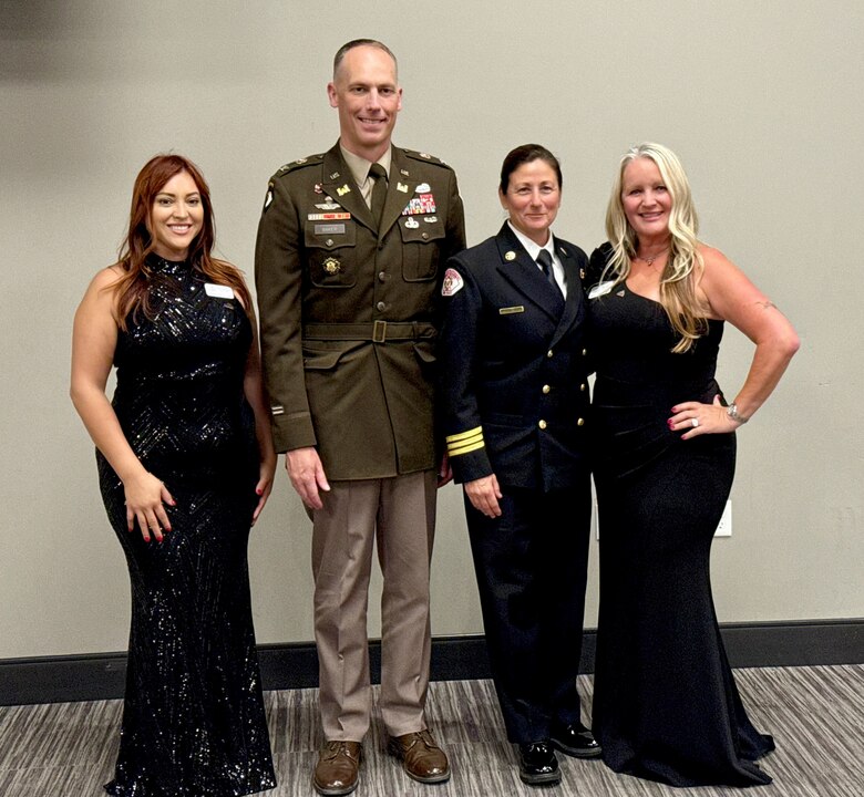 From left, Stephani Valdez, vice president of the National Association of Women in Construction Los Angeles Chapter; Col. Andrew Baker, commander of the U.S. Army Corps of Engineers Los Angeles District; Assistant Fire Chief Karen Rindone of the Long Beach Fire Department, the event’s keynote speaker; and Dawn Davis, president of the NAWIC Los Angeles Chapter, gather for a photo following the NAWIC Los Angeles Chapter’s Board of Directors Installation Gala Sept. 16 at the Los Angeles County Fire Museum.