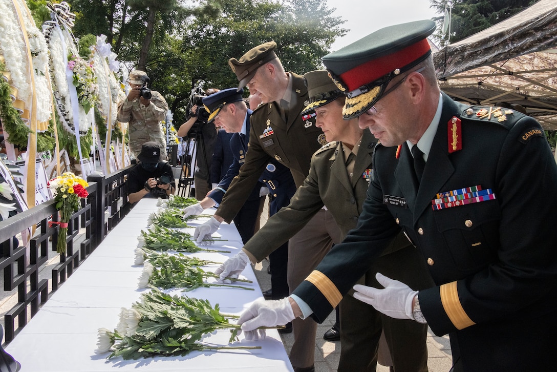 Canadian Armed Forces Lt. Gen. Derek Macaulay, deputy commander of United Nations Command, right, U.S. Marine Corps Maj. Gen. Valerie A. Jackson, commander of U.S. Marine Corps Forces Korea, center-right, U.S. Army Maj. Gen. William D. “Hank” Talyor, acting commander of Eighth Army, and other leaders place flowers down in honor of the fallen during a floral tribute event commemorating the 75th anniversary of the landing at Incheon, in Incheon, South Korea, Sept. 15, 2025. The commemoration honored the strategic success of the landing, which turned the tide of the Korean War, and paid tribute to the sacrifices made by Republic of Korea and United Nations Command Forces. (U.S. Marine Corps photo by Cpl. Simon Saravia)