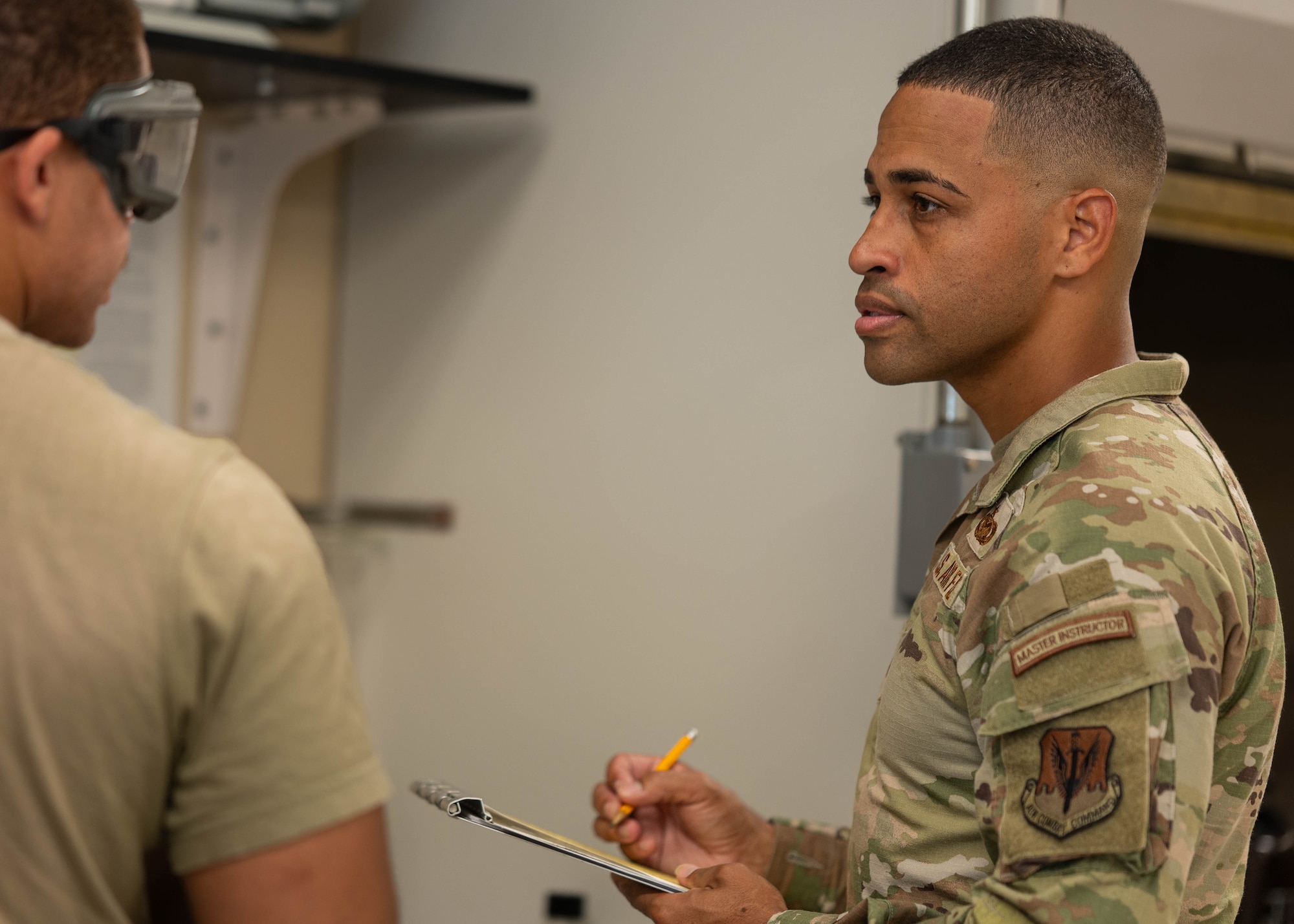 U.S. Air Force Master Sgt. Brandon Vazquez, 325th Logistics Readiness Squadron Petroleum, Oils and Lubricants section chief, performs an inspection of a fuel sample