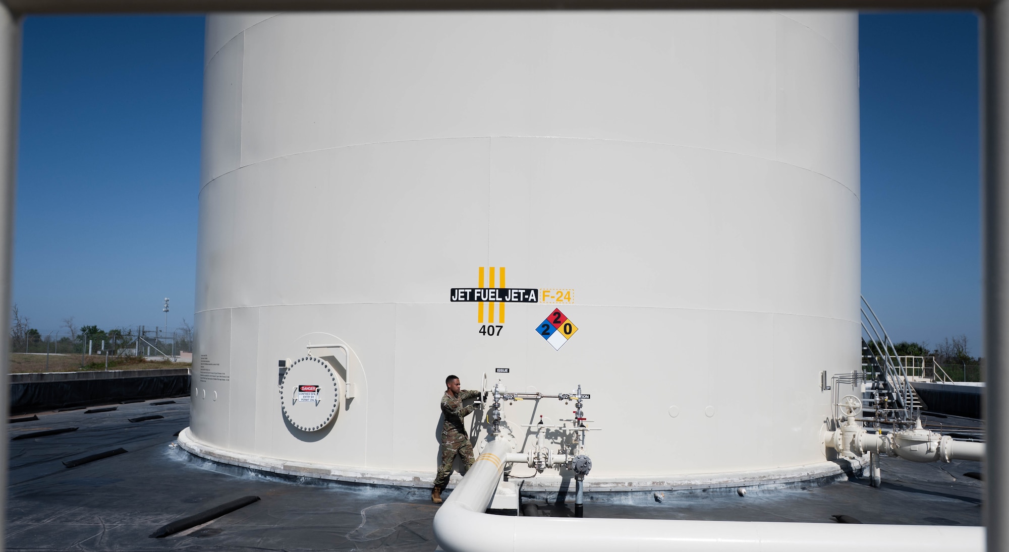 U.S. Air Force Master Sgt. Brandon Vazquez, 325th Logistics Readiness Squadron Petroleum, Oils and Lubricants section chief, opens the issue line to provide fuel for a 14-refueler fleet
