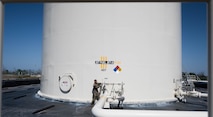 U.S. Air Force Master Sgt. Brandon Vazquez, 325th Logistics Readiness Squadron Petroleum, Oils and Lubricants section chief, opens the issue line to provide fuel for a 14-refueler fleet