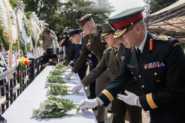 Canadian Armed Forces Lt. Gen. Derek Macaulay, deputy commander of United Nations Command, right, U.S. Marine Corps Maj. Gen. Valerie A. Jackson, commander of U.S. Marine Corps Forces Korea, center-right, U.S. Army Maj. Gen. William D. “Hank” Talyor, acting commander of Eighth Army, and other leaders place flowers down in honor of the fallen during a floral tribute event commemorating the 75th anniversary of the landing at Incheon, in Incheon, South Korea, Sept. 15, 2025. The commemoration honored the strategic success of the landing, which turned the tide of the Korean War, and paid tribute to the sacrifices made by Republic of Korea and United Nations Command Forces. (U.S. Marine Corps photo by Cpl. Simon Saravia)
