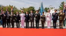 Korean War veterans, civilian leaders, and service members with United Nations Command, United States Forces Korea, the Republic of Korea Navy, and the ROK Marine Corps pose for a group photo during a monument reveal event commemorating the 75th anniversary of the landing at Incheon, in Incheon, South Korea, Sept. 15, 2025. The commemoration honored the strategic success of the landing, which turned the tide of the Korean War, and paid tribute to the sacrifices made by Republic of Korea and United Nations Command Forces. (U.S. Marine Corps photo by Cpl. Simon Saravia)