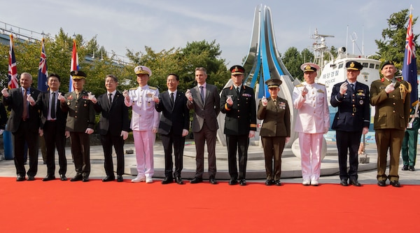 Korean War veterans, civilian leaders, and service members with United Nations Command, United States Forces Korea, the Republic of Korea Navy, and the ROK Marine Corps pose for a group photo during a monument reveal event commemorating the 75th anniversary of the landing at Incheon, in Incheon, South Korea, Sept. 15, 2025. The commemoration honored the strategic success of the landing, which turned the tide of the Korean War, and paid tribute to the sacrifices made by Republic of Korea and United Nations Command Forces. (U.S. Marine Corps photo by Cpl. Simon Saravia)