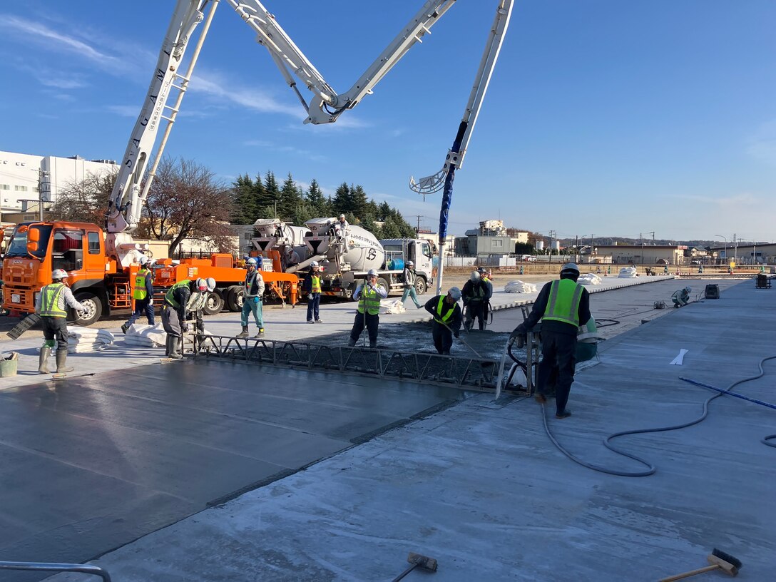 Contractors perform concrete-laying operations in support of the $44.1 million Yokota Air Base Airfield Damage Repair facility, December 5, 2025.