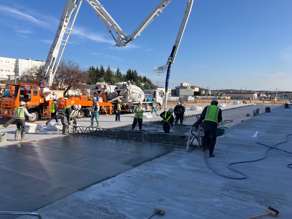 Contractors perform concrete-laying operations in support of the $44.1 million Yokota Air Base Airfield Damage Repair facility, December 5, 2025.