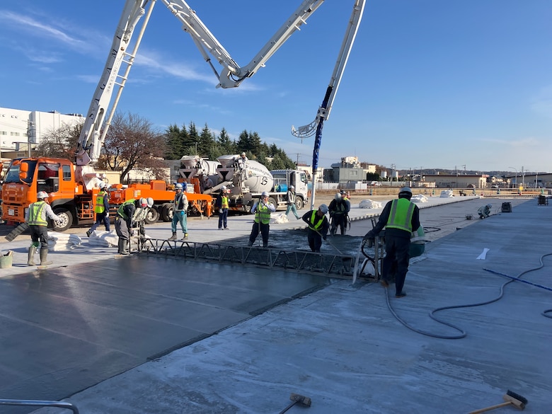 Contractors perform concrete-laying operations in support of the $44.1 million Yokota Air Base Airfield Damage Repair facility, December 5, 2025.