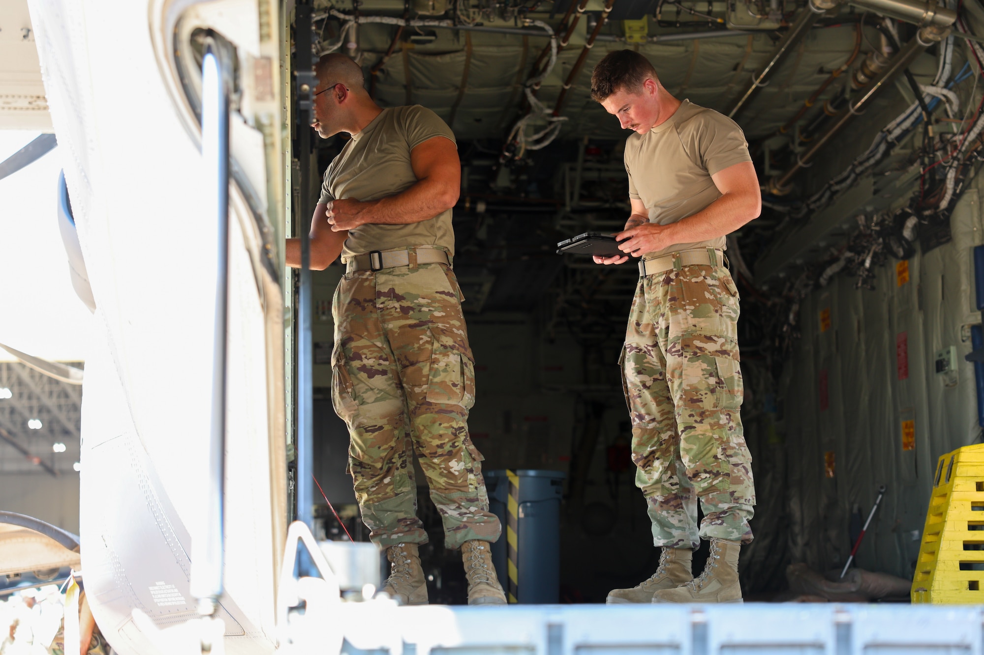 U.S. Air Force Airmen in Training, assigned to the 82nd Training Wing, complete pre-check inspections on the door of a C-130 Hercules during a Bracer Forge exercise at Sheppard Air Force Base, Texas, Sept. 11, 2025.