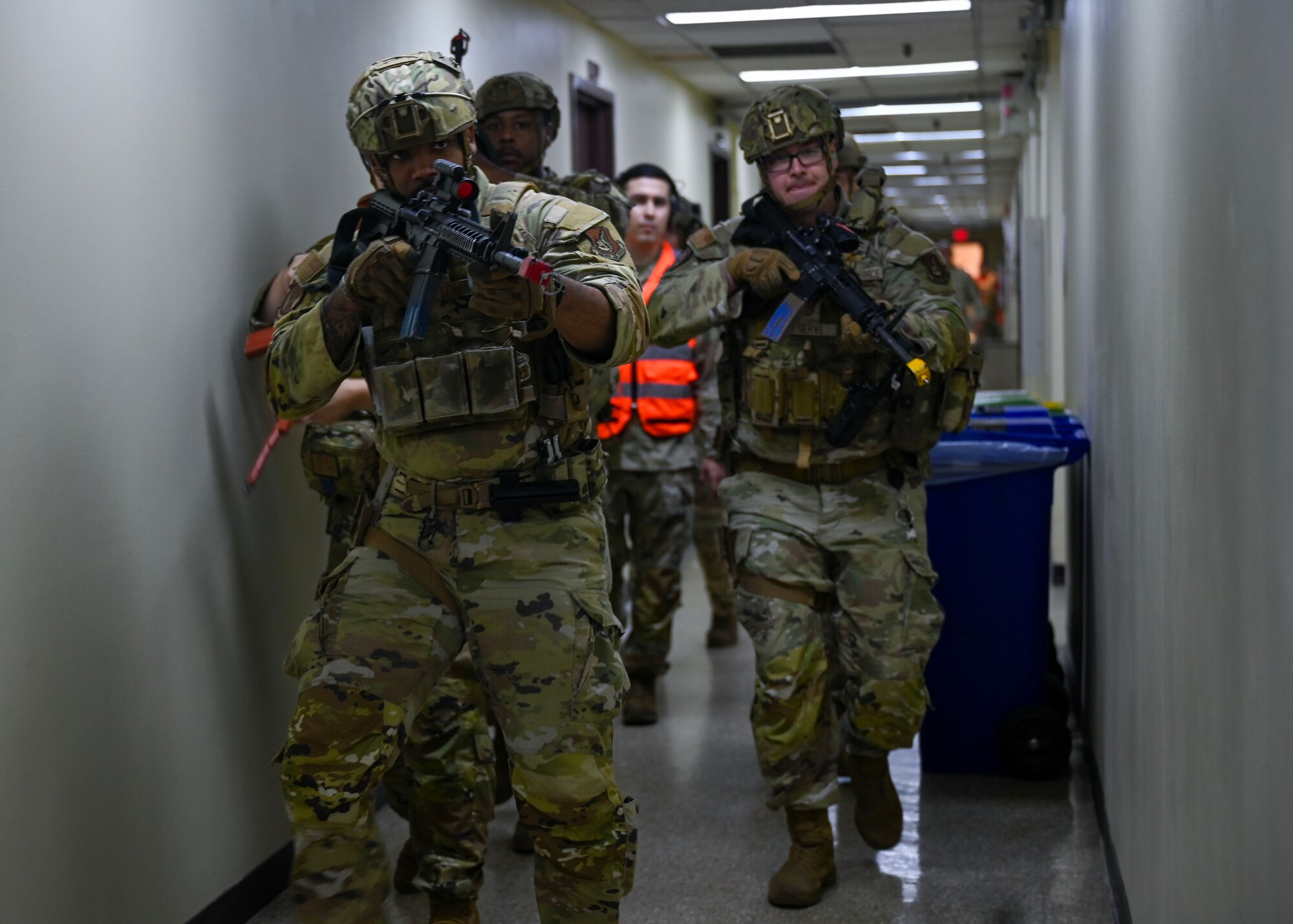 Defenders assigned to the 51st Security Forces Squadron prepare to engage with the simulated perpetrator during an active shooter exercise at Osan Air Base, Republic of Korea, Sept. 18, 2025. The exercise ensures Team Osan remains vigilant and prepared for real-world threats. (U.S. Air Force photo by Staff Sgt. Sarah Williams)