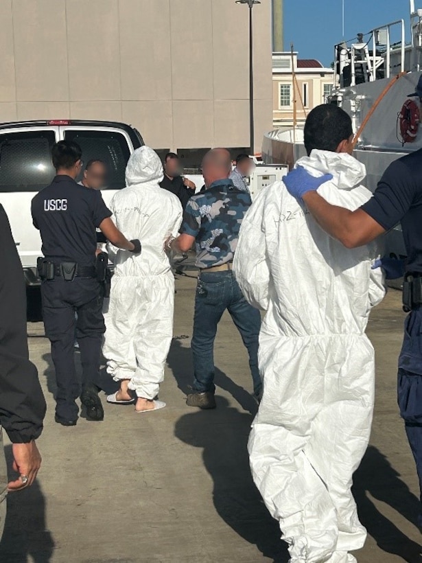 Coast Guard Heriberto Hernandez crewmembers transfer two suspected smugglers and 50 kilograms of cocaine to Coast Guard Investigative Service agents and Department of Homeland Security law enforcement partner agencies in San Juan, Puerto Rico, Sept. 12, 2025. Coast Guard Cutter Heriberto Hernandez interdicted a go-fast smuggling vessel off Dominican Republic, Aug. 31, 2025, which led to the seizure of the contraband and the apprehension of four smugglers.  Two other smugglers apprehended in this case were transferred to Dominican Republic Navy authorities. (U.S. Coast Guard photo)