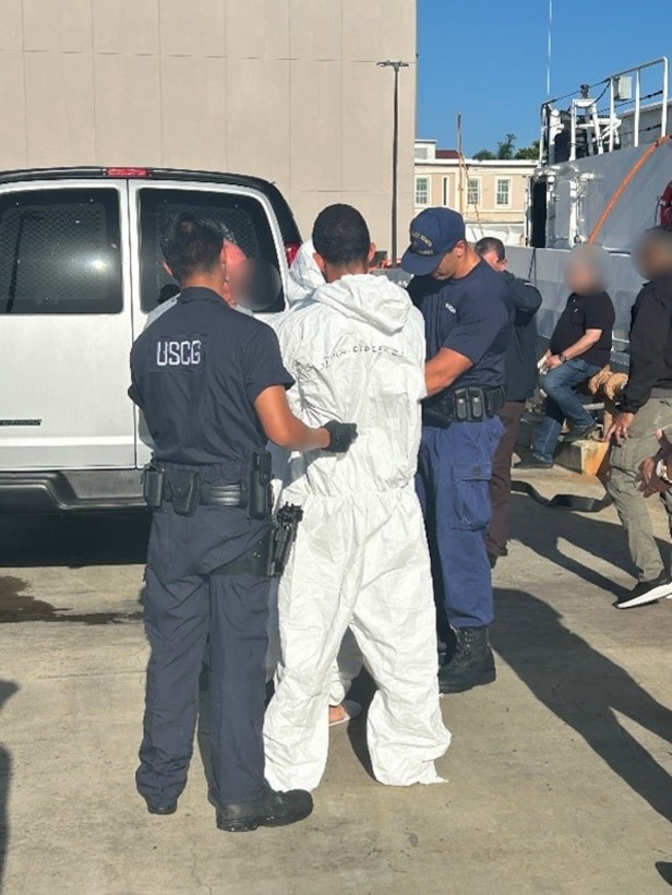 Coast Guard Heriberto Hernandez crewmembers transfer two suspected smugglers and 50 kilograms of cocaine to Coast Guard Investigative Service agents and Department of Homeland Security law enforcement partner agencies in San Juan, Puerto Rico, Sept. 12, 2025. Coast Guard Cutter Heriberto Hernandez interdicted a go-fast smuggling vessel off Dominican Republic, Aug. 31, 2025, which led to the seizure of the contraband and the apprehension of four smugglers.  Two other smugglers apprehended in this case were transferred to Dominican Republic Navy authorities. (U.S. Coast Guard photo)