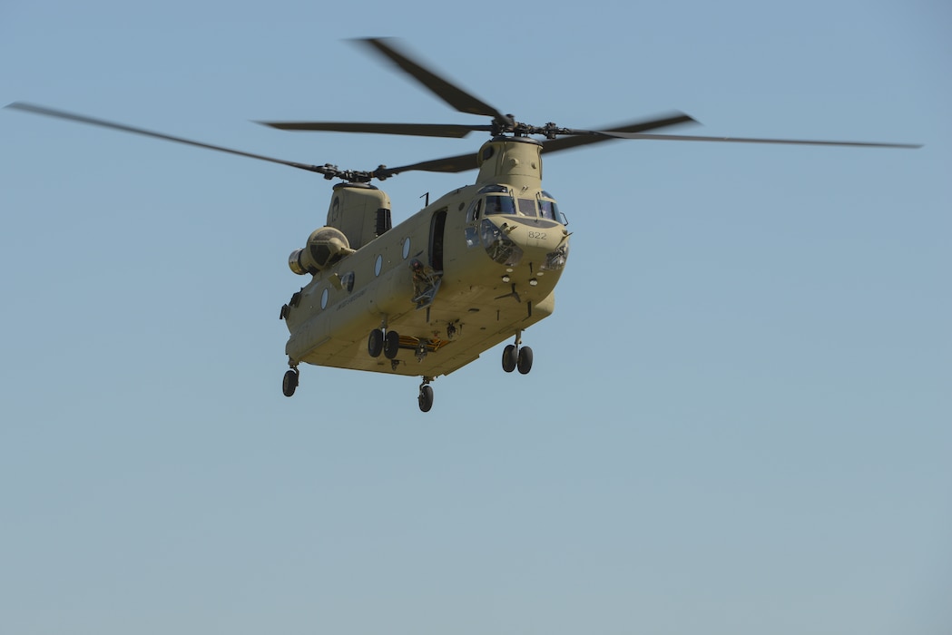 A U.S. Army CH-47 Chinook helicopter of the Army National Guard’s Bravo Company, 171st Aviation Regiment, flies in the air.