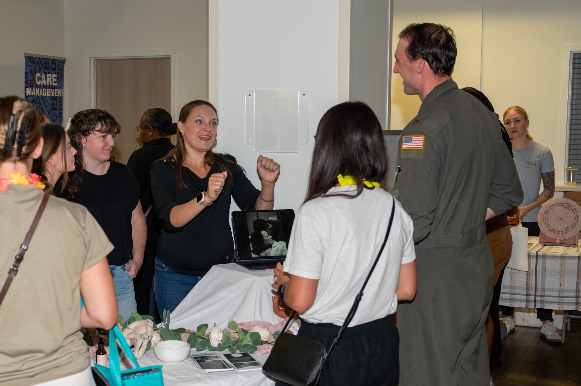 women interacting with a service member