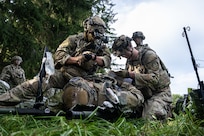 Airmen taking care of patient