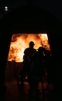 The 5th Civil Engineer Squadron’s fire protection team extinguishes an ongoing fire during a live aircraft fire exercise at Minot Air Force Base, North Dakota, Sept. 16, 2025. Live burn training keeps firefighters prepared and provides them with a realistic fire experience before responding to an emergency. (U.S. Air Force photo by Senior Airman Alyssa Bankston)