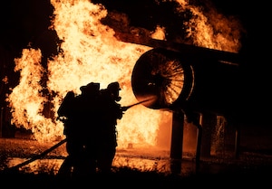 The 5th Civil Engineer Squadron’s fire protection team extinguishes an ongoing fire during a live aircraft fire exercise at Minot Air Force Base, North Dakota, Sept. 16, 2025. Fire prevention professionals receive regular training to stay ready to handle everything from bush fires to flames caused by burning rocket fuel and hazardous materials. (U.S. Air Force photo by Senior Airman Alyssa Bankston)