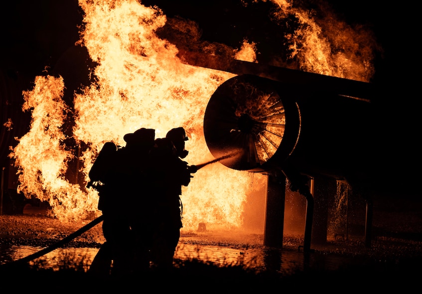 The 5th Civil Engineer Squadron’s fire protection team extinguishes an ongoing fire during a live aircraft fire exercise at Minot Air Force Base, North Dakota, Sept. 16, 2025. Fire prevention professionals receive regular training to stay ready to handle everything from bush fires to flames caused by burning rocket fuel and hazardous materials. (U.S. Air Force photo by Senior Airman Alyssa Bankston)