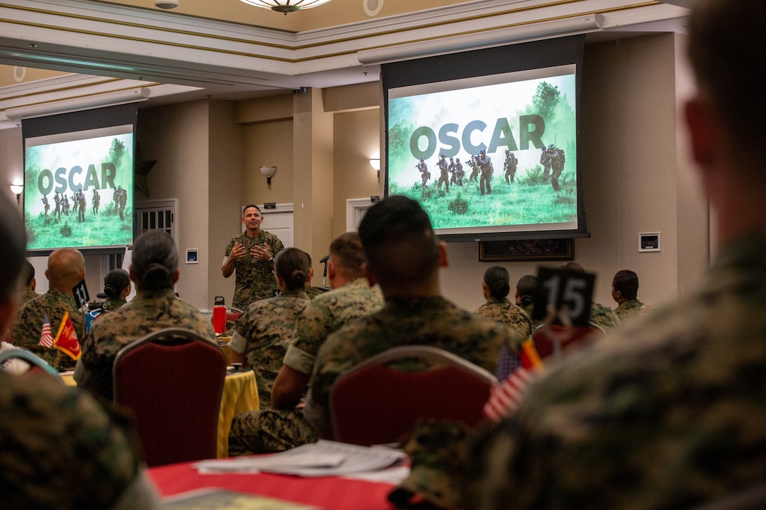 U.S. Marine Corps Sgt. Maj. Carlos A. Ruiz, the 20th sergeant major of the marine corps, gives closing remarks to encourage Marines and Sailors in attendance to implement the skills learned during the Operational Stress Control and Readiness (OSCAR) training event hosted by Manpower and Reserve Affairs, Marine and Family Programs Division at Marine Corps Base Quantico, Virginia, September 9-10, 2025. The OSCAR training event advocated the importance of Marine Corps Total fitness, mental health, and informed participants on the process of implementing a team of trained Marines and Sailors into units who can recognize and mitigate stress to maintain resiliency and lethality in Marines. (U.S. Marine Corps Photo by Cpl. Anthony C. Ramsey Jr.)