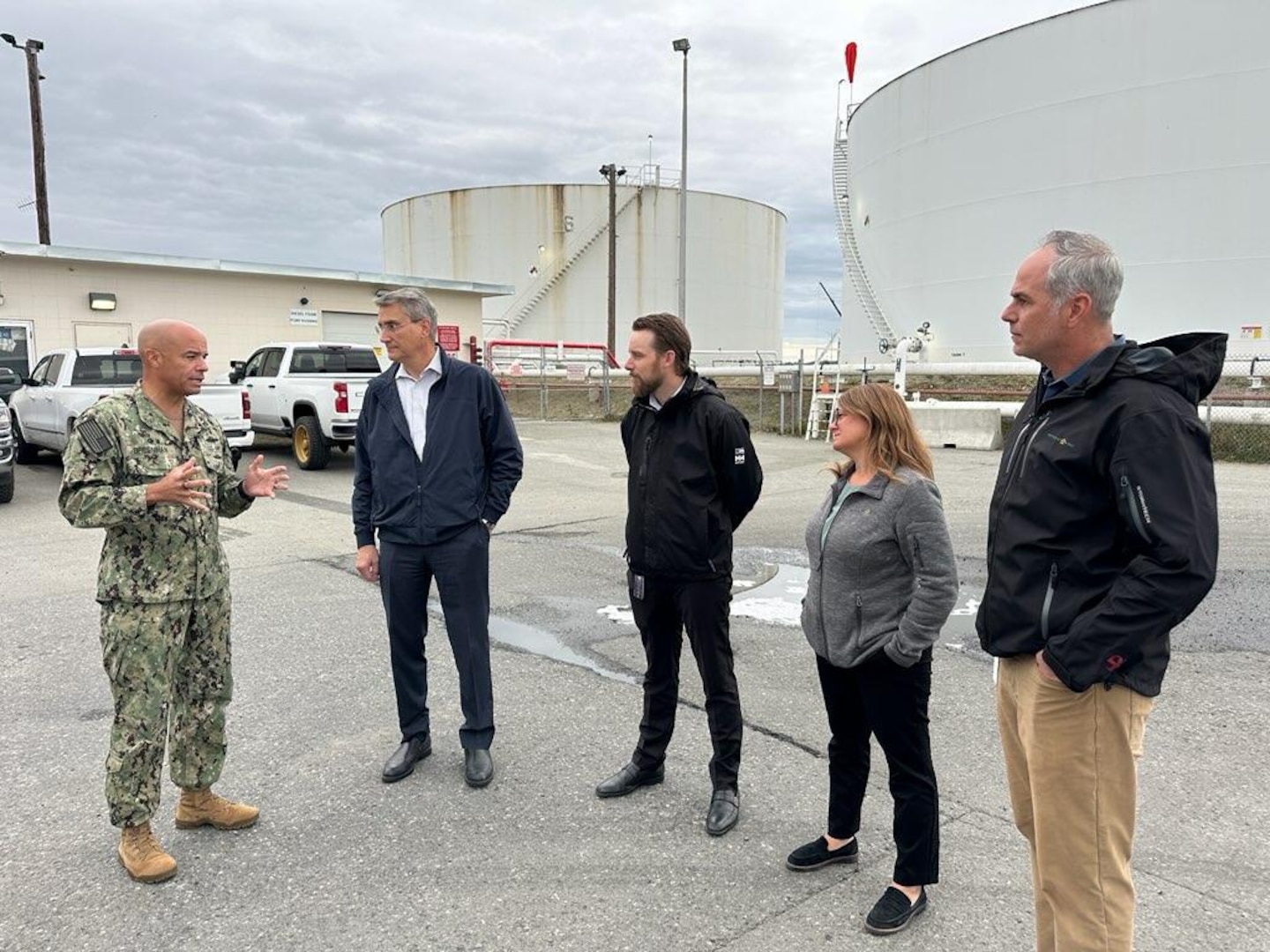 RDML Bresnihan standing next to representatives from DLA Energy's industry partners and sharing the Agency’s priorities for achieving mission success in the region.