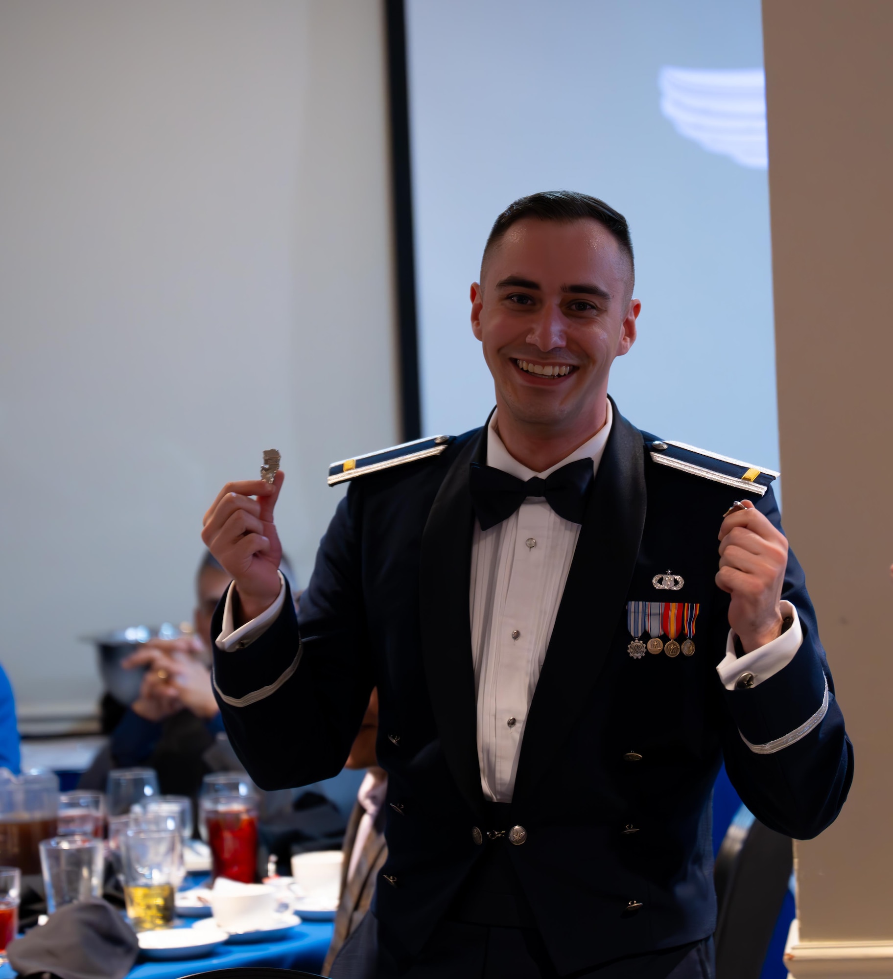 U.S. Air Force Airmen from graduating Class 25-15 break their wings at Laughlin Air Force Base, Texas, Sept. 18, 2025. Thirty-four U.S. Air Force officers were awarded silver wings during the ceremony, symbolizing their completion of the Undergraduate Pilot Training program. (U.S. Air Force photo by Airman 1st Class Harrison Sullivan)
