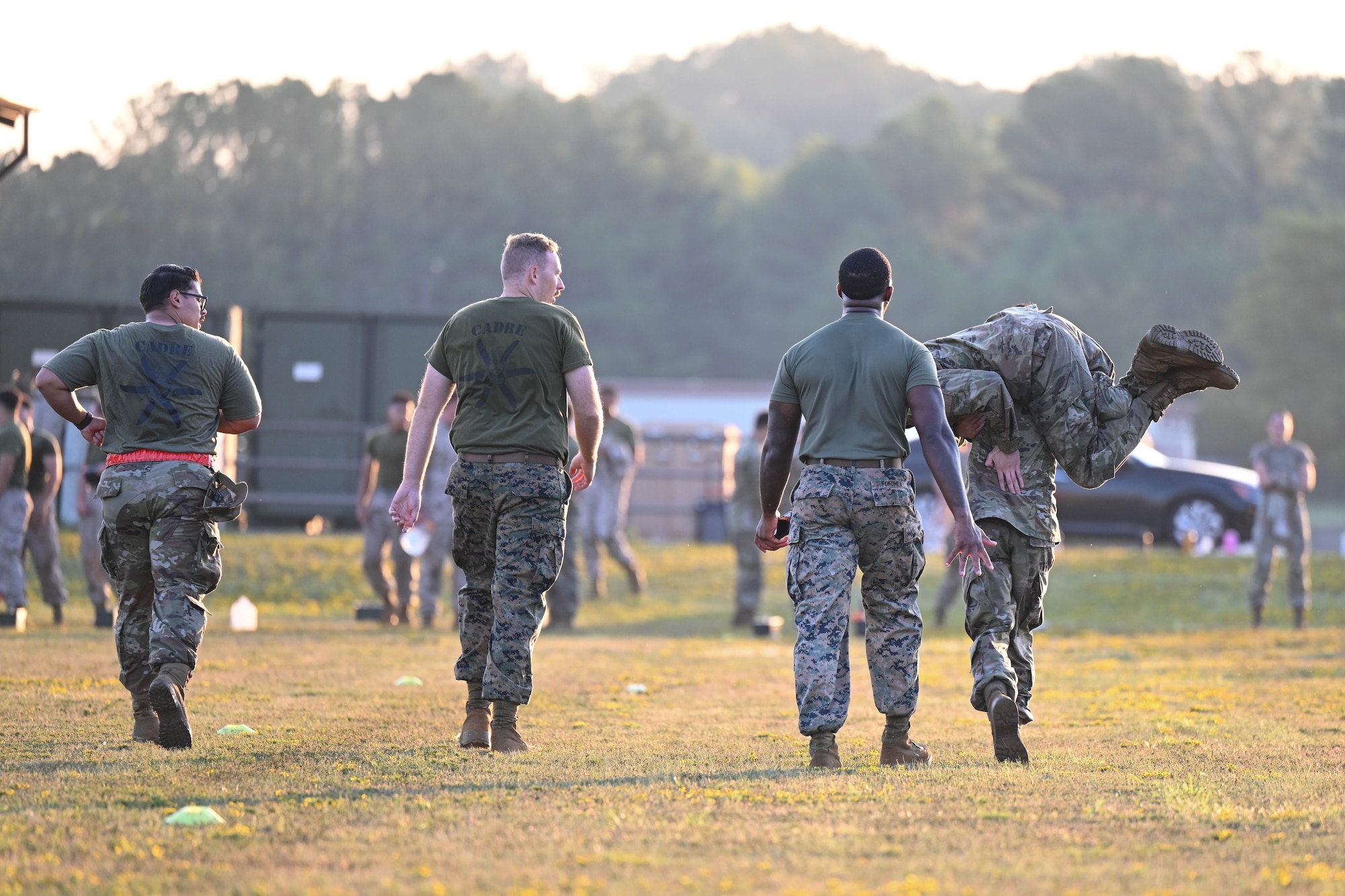 A group of men in uniform walk down a field.