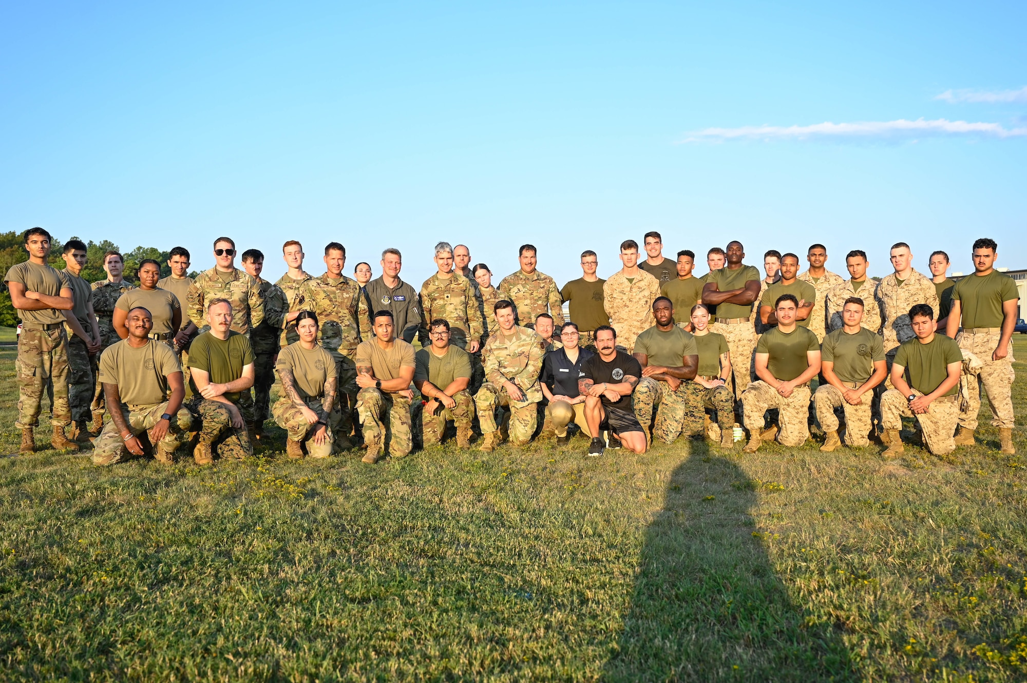 A group of people in uniform pose for a photo.