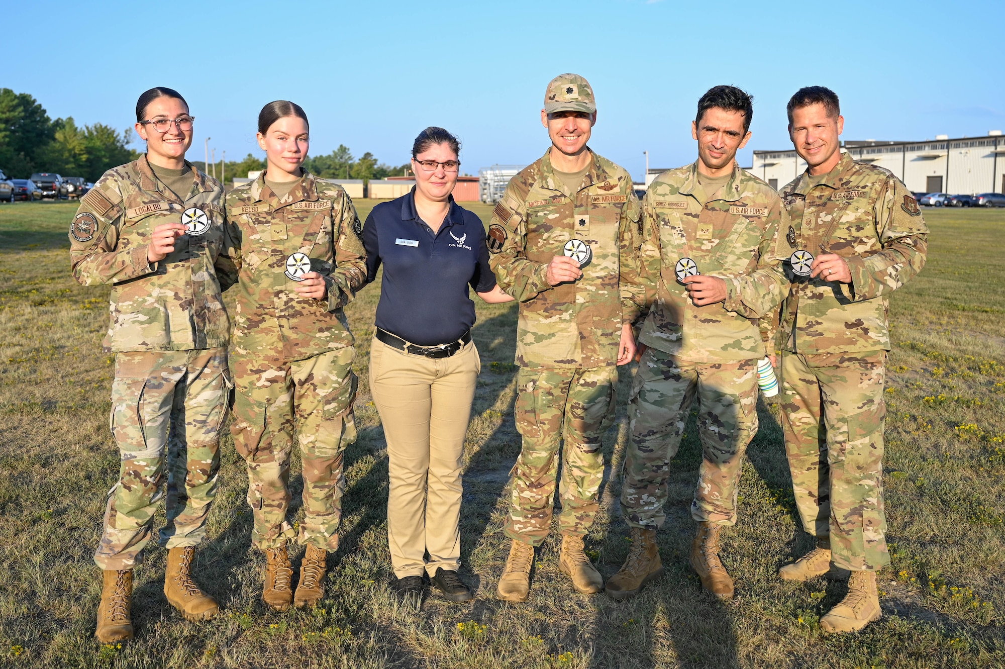 A group of people in uniform pose for a photo.