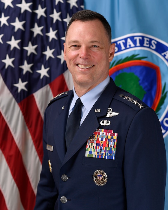 A military member stands for a portrait.