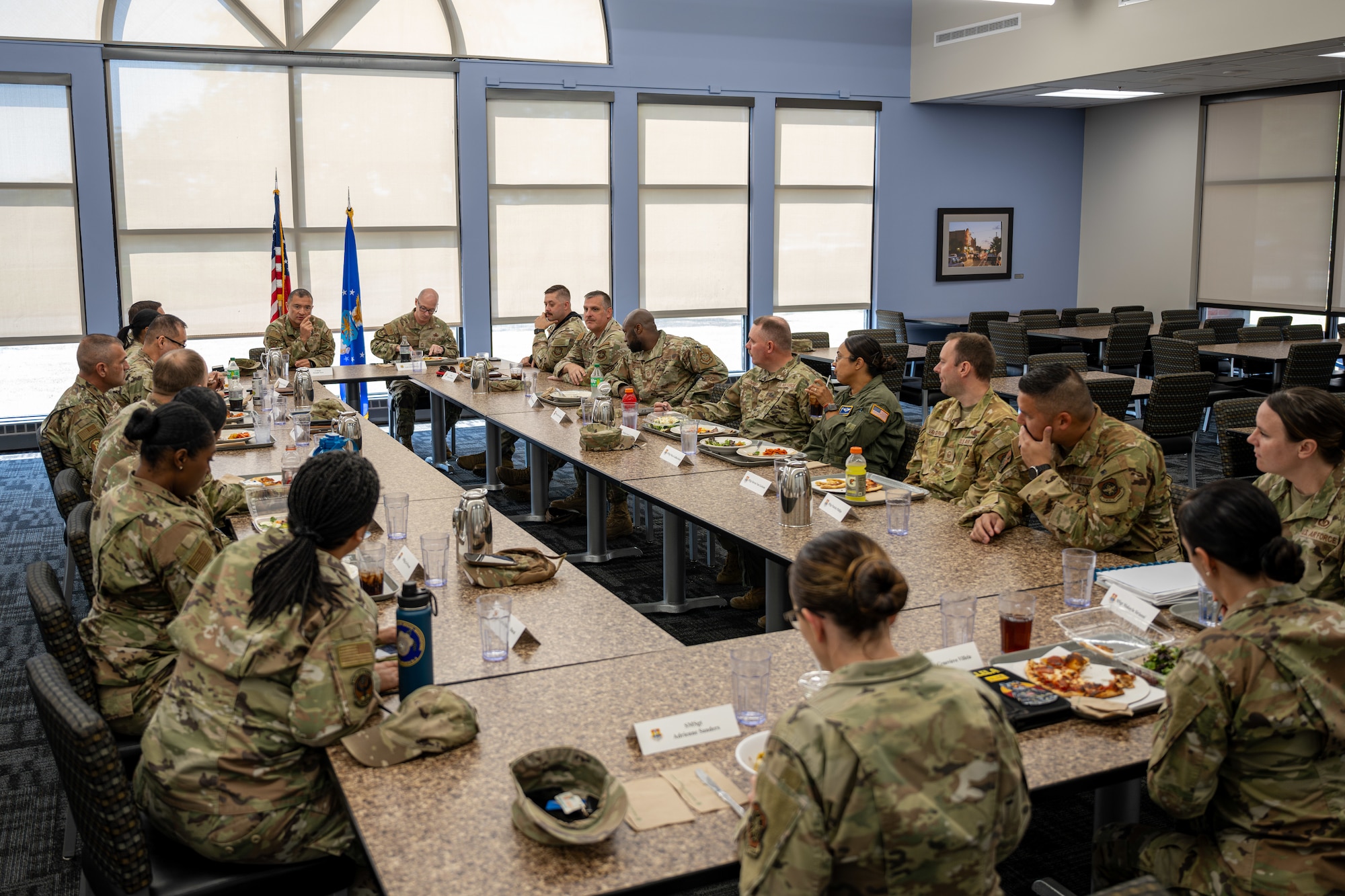 Airmen sit around a table