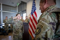 Cadet saluting an officer in uniform