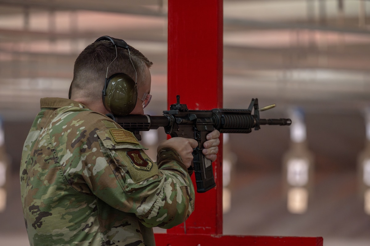 An Airman assigned to McConnell Air Force Base fires an M4 from the standing unsupported position during the Rifle Elementary Excellence in Competition (EEIC) hosted by the 22nd Security Forces Squadron at McConnell AFB, Kansas, Sept. 18, 2025. Ninety-six Airmen competed with the M4 carbine, iron sights only, with the top 10 percent earning official recognition for their marksmanship achievement. (U.S. Air Force photo by Airman 1st Class Paula Arce)