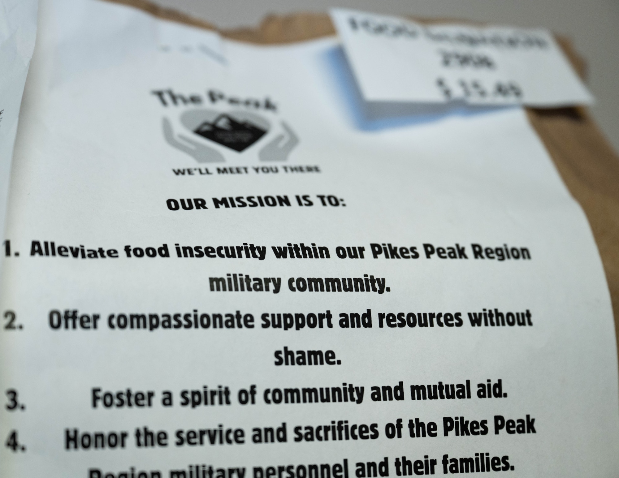 A mission statement is shown on a table.
