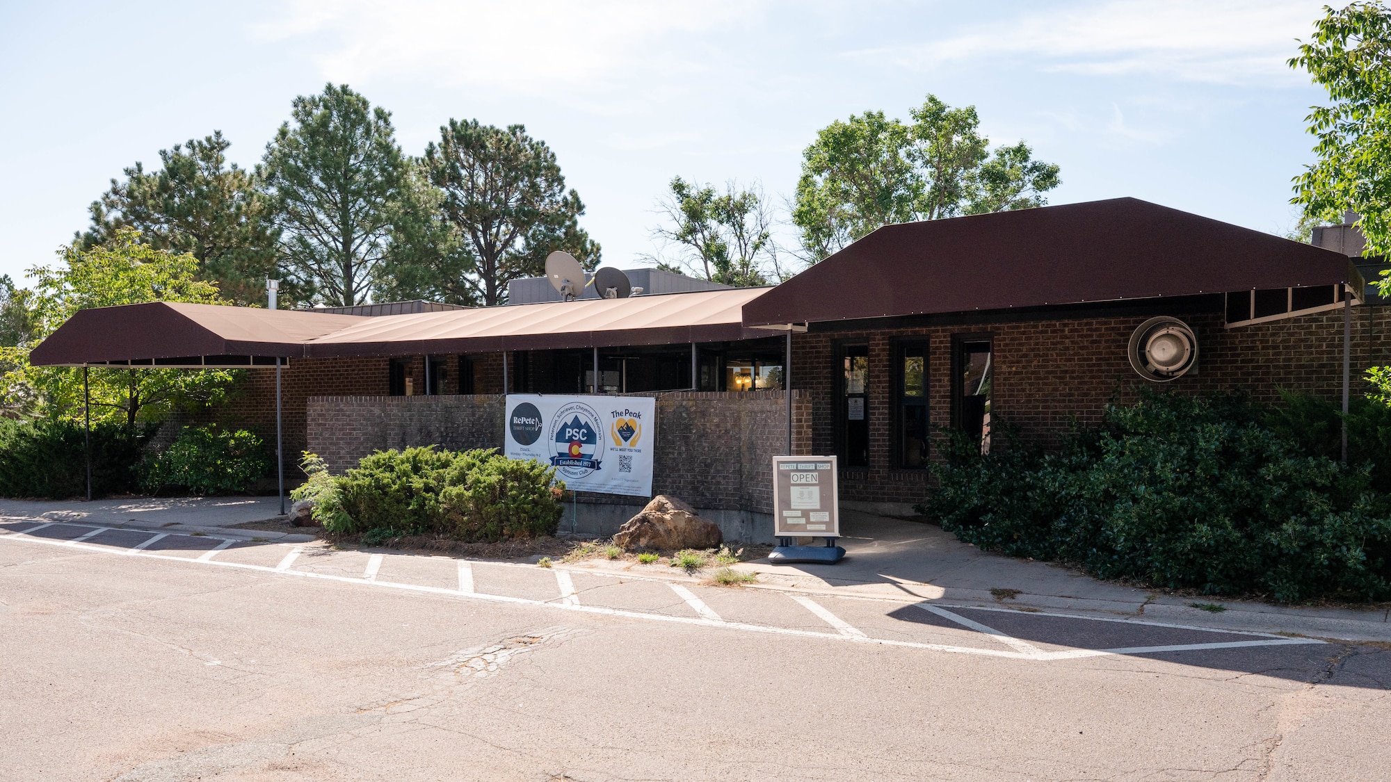 The RePete Thrift Shop is shown with a banner outside.