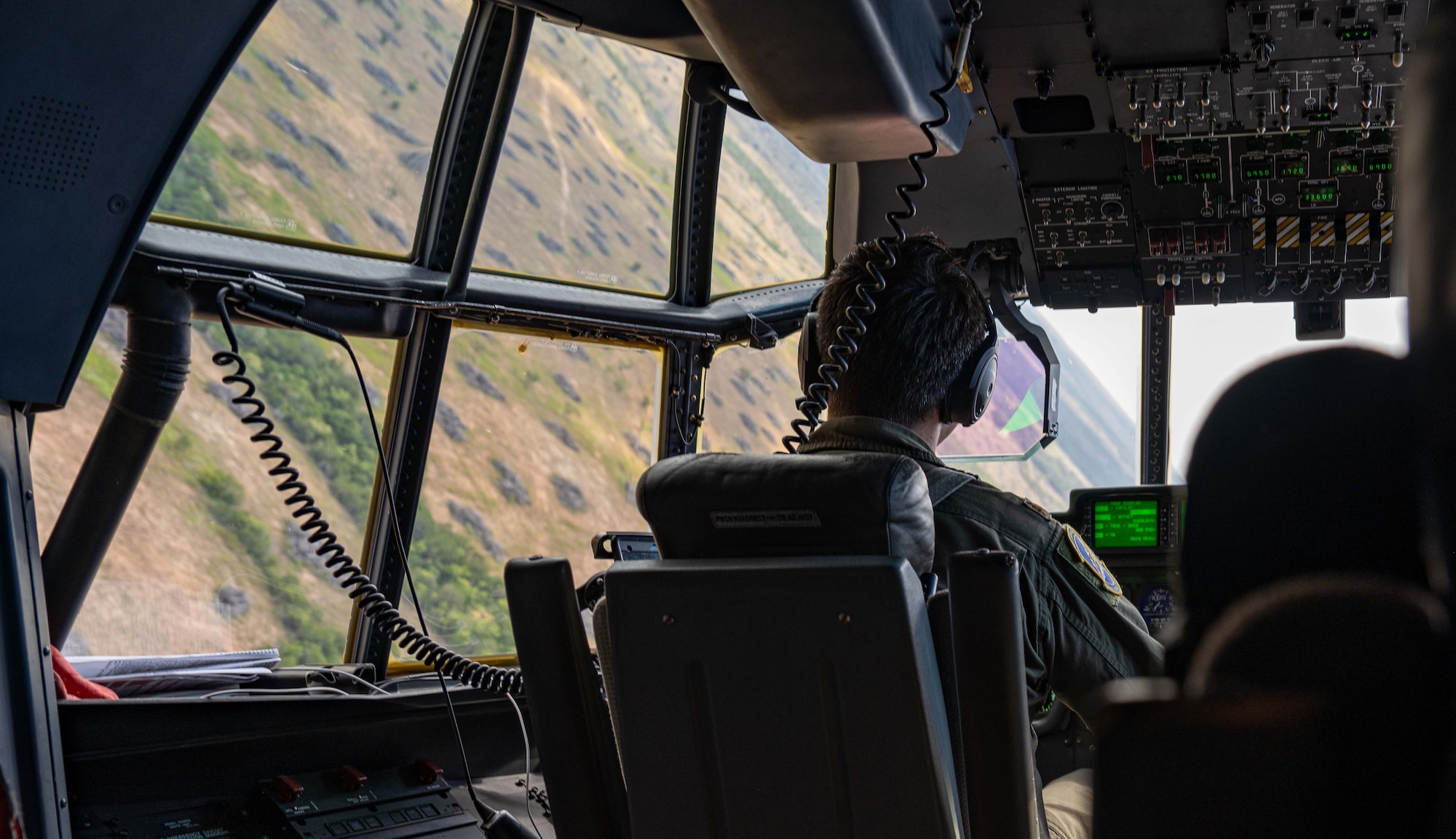 U.S. Air Force Maj. Cason Soat, 40th Airlift Squadron director of operations, maneuvers a C-130J Super Hercules assigned to the 317th Airlift Wing during a local training flight near Dyess Air Force Base, Texas, Aug. 26, 2025. During the local training sortie, aircrews conducted low-level flying and formation maneuvers to maintain proficiency in a variety of flight capabilities. (U.S. Air Force photo by Senior Airman Jade M. Caldwell)