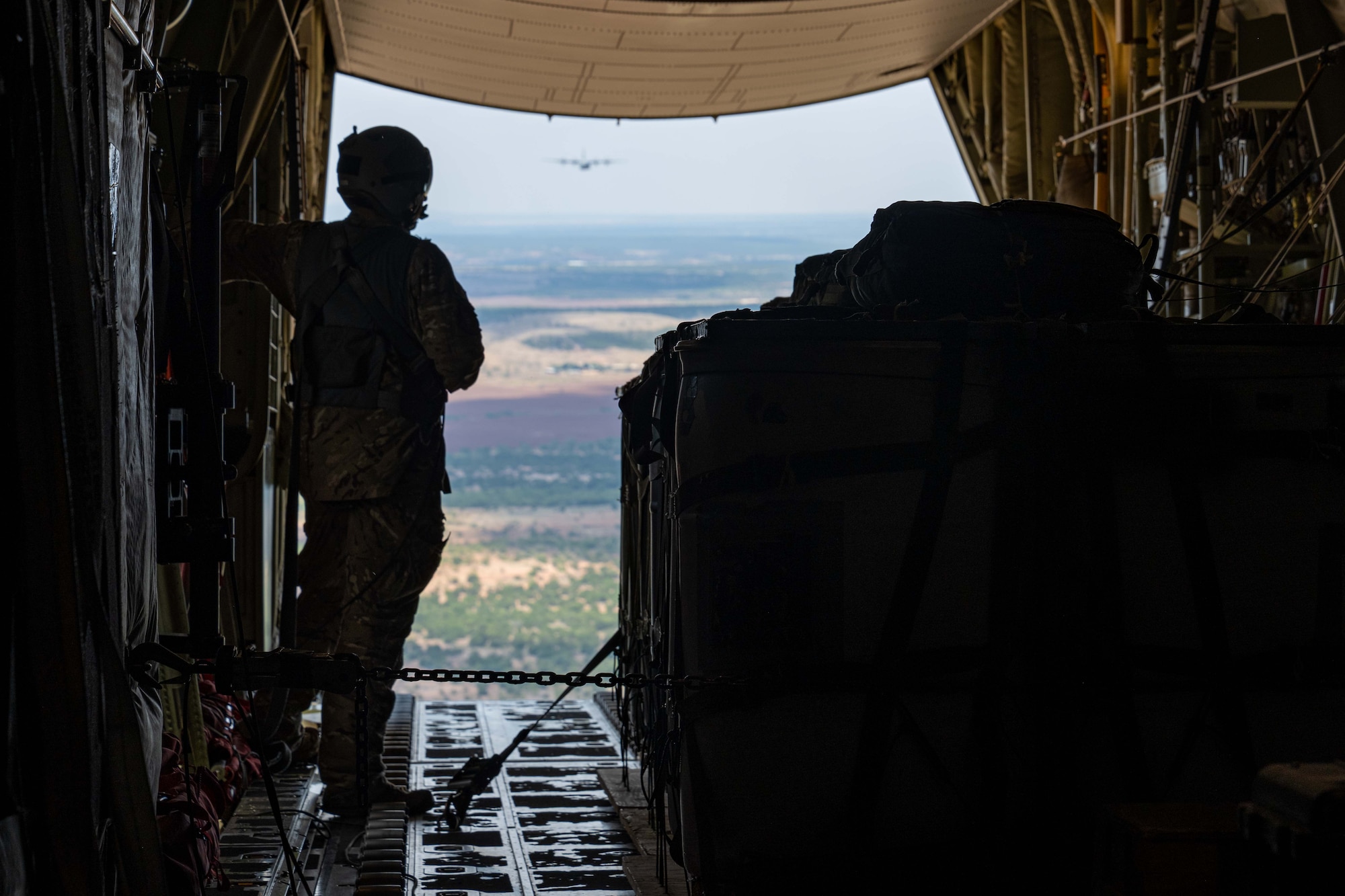 U.S. Air Force Senior Airman Tobin Moore, 40th Airlift Squadron loadmaster, prepares cargo for an airdrop from a C-130J Super Hercules assigned to the 317th Airlift Wing  near Dyess Air Force Base, Texas, Aug. 26, 2025. Airdrops are essential for delivering critical supplies and equipment to remote locations. (U.S. Air Force photo by Senior Airman Jade M. Caldwell)