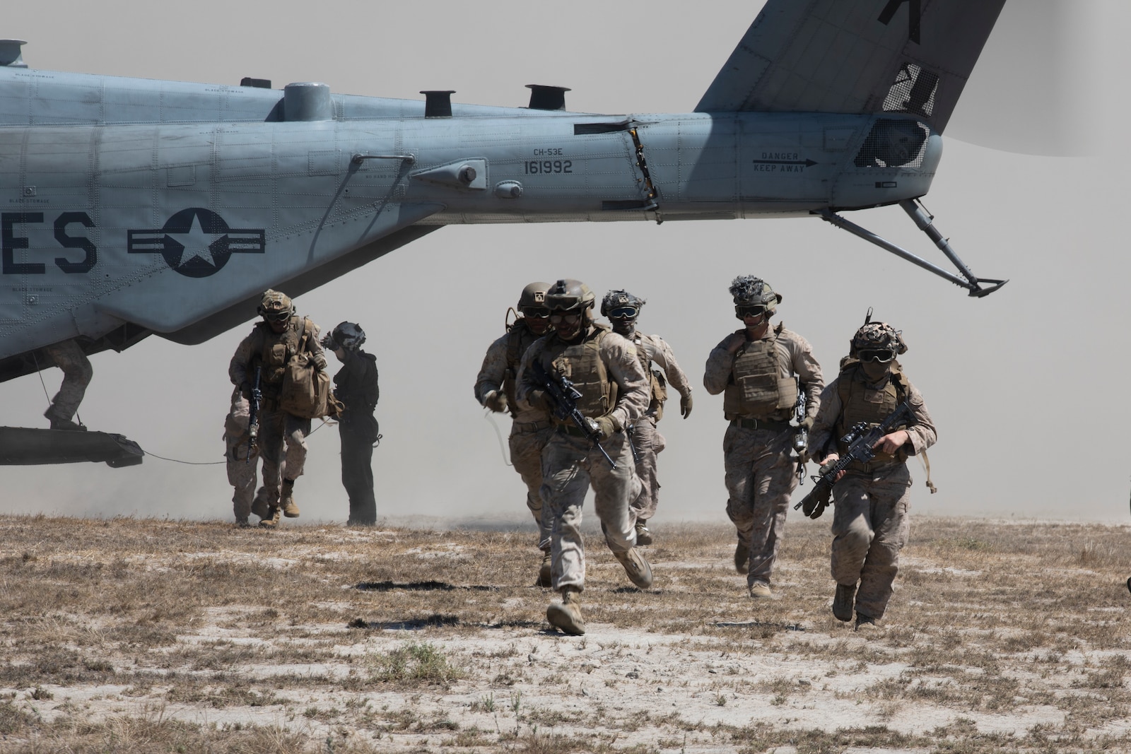 U.S. Marines assigned to Charlie Battery, 1st Battalion, 11th Marine Regiment, 1st Marine Division, exit a CH-53E Super Stallion helicopter assigned to Marine Heavy Helicopter Squadron (HMH) 465, Marine Aircraft Group 16, 3rd Marine Aircraft Wing, during a helo raid as part of Exercise Cobra Fury 25.5 at Marine Corps Base Camp Pendleton, California, Sept. 11, 2025. Cobra Fury 25.2 is an annual exercise designed to improve the battalion’s ability to deploy artillery and M142 High Mobility Artillery Rocket Systems to provide accurate, long-range fire in key terrain. (U.S. Marine Corps photo by Lance Cpl. Diego Berumen)