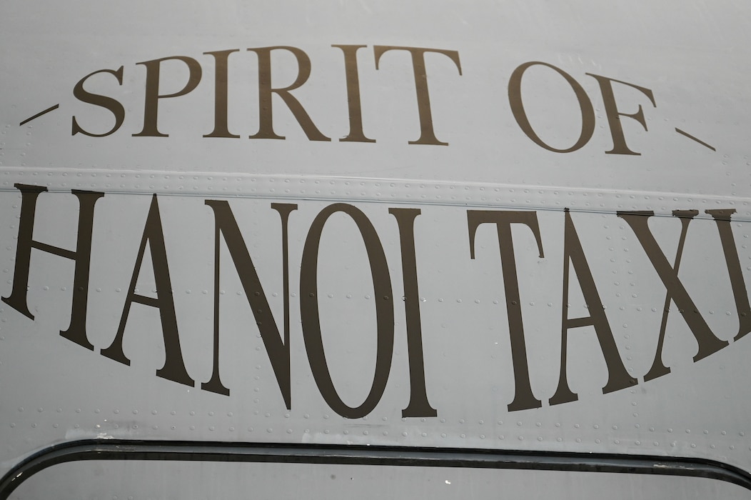 The newly re-designated name, “Spirit of Hanoi Taxi,” is shown on a C-17 Globemaster III with tail number 99-0165 during an unveiling ceremony at Wright-Patterson Air Force Base, Ohio, Sept. 19, 2025. The renaming was part of Operation Honor, paying tribute to the bond between the 445th Airlift Wing and the original C-141 Starlifter Hanoi Taxi, which repatriated American POWs from Vietnam and brought them back home.  (U.S. Air Force photo by Staff Sgt. Johnathan Quiñones)