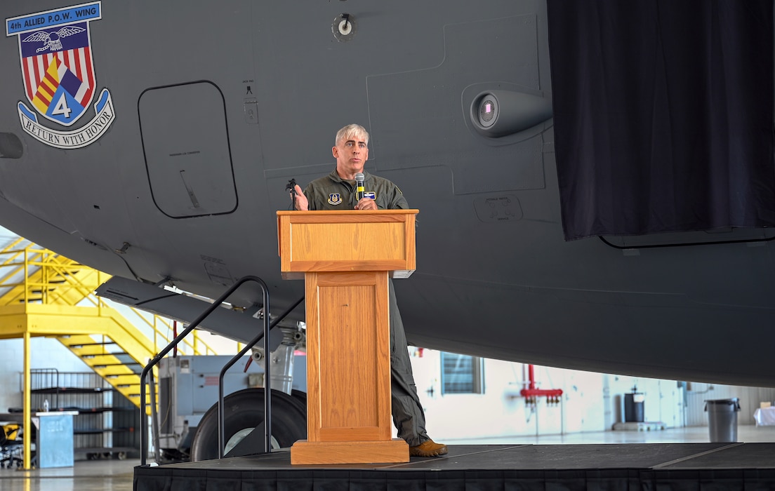 U.S. Air Force Col. Douglas A. Perry Jr., 445th Airlift Wing commander, provides opening remarks before the keynote speaker during the “Spirit of Hanoi Taxi” unveiling ceremony at Wright-Patterson Air Force Base, Ohio, Sept. 19, 2025. The ceremony was part of Operation Honor, paying tribute to the bond between the 445th Airlift Wing and the original C-141 Starlifter Hanoi Taxi, which repatriated American POWs from Vietnam and brought them back home.  (U.S. Air Force photo by Staff Sgt. Johnathan Quiñones)