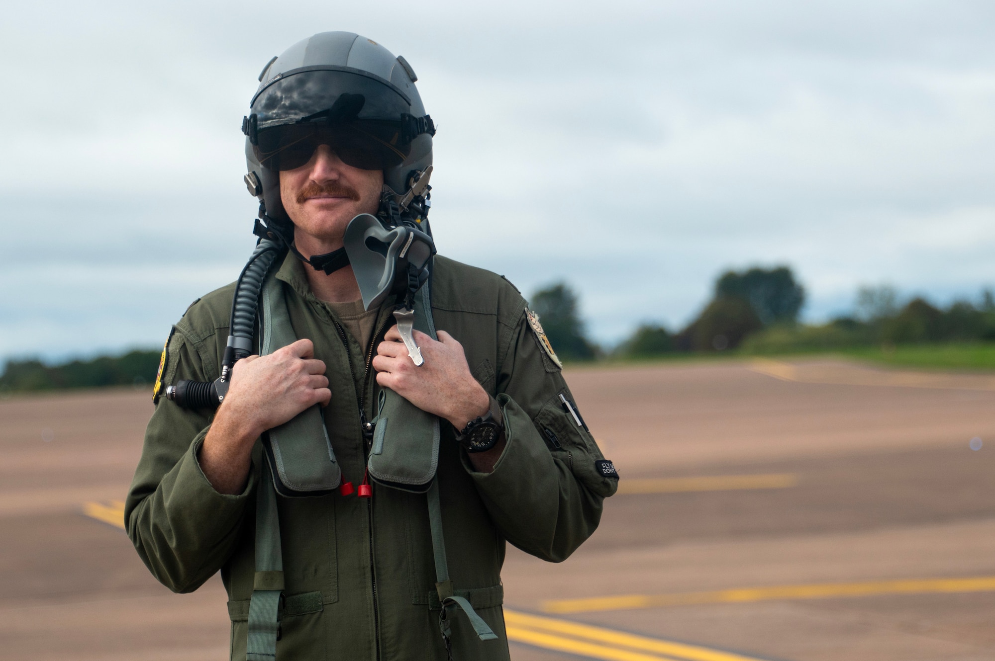 U.S. Air Force Maj. William Hacker, a pilot assigned to the 93rd Bomb Squadron, Barksdale Air Force Base, Louisiana, waits to board a B-52H Stratofortress aircraft during Exercise Cobra Warrior 25-2 at RAF Fairford, England, Sept. 18, 2025. CW-25-2 allows participating aircrew and support elements to train in areas like joint mission planning, integration, and tactical skills, ensuring our readiness to accomplish specific military objectives within a defined area and timeframe. (U.S. Air Force photo by Staff Sgt. Tambri Cason)