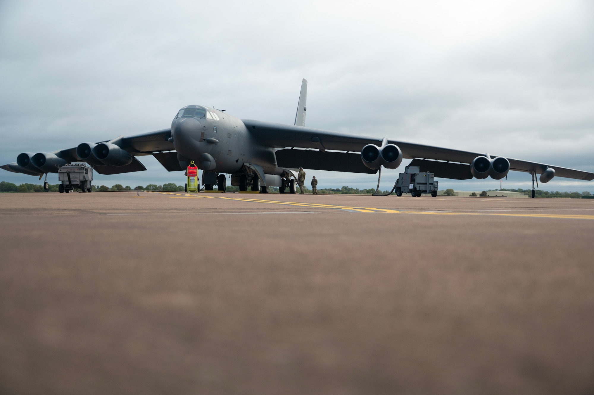 Two U.S. Air Force Airmen, both crew chiefs assigned to the 307th Bomb Wing, prepare to launch a B-52H Stratofortress aircraft during Exercise Cobra Warrior 25-2 at RAF Fairford, England, Sept. 18, 2025. The RAF-led Exercise has been hosted by the United Kingdom bi-annually since 2019, focusing on operational and tactical high-end spectrum warfighting in a contested, degraded and limited operating environment. (U.S. Air Force photo by Staff Sgt. Tambri Cason)