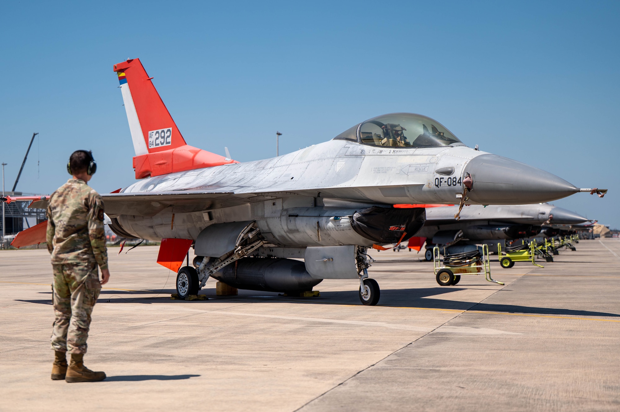 U.S. Air Force Tech. Sgt. Brandon Murdaugh, 83rd Fighter Squadron weapons system program evaluator, observes a QF-16 Full-Scale Aerial Target during Weapons System Evaluation Program Combat Archer 25.09 at Tyndall Air Force Base.