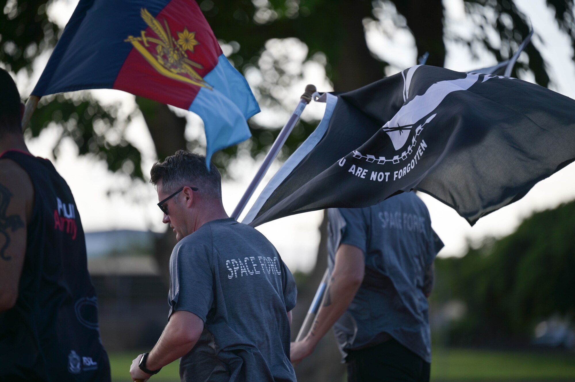 Runner holding the POW/MIA flag.