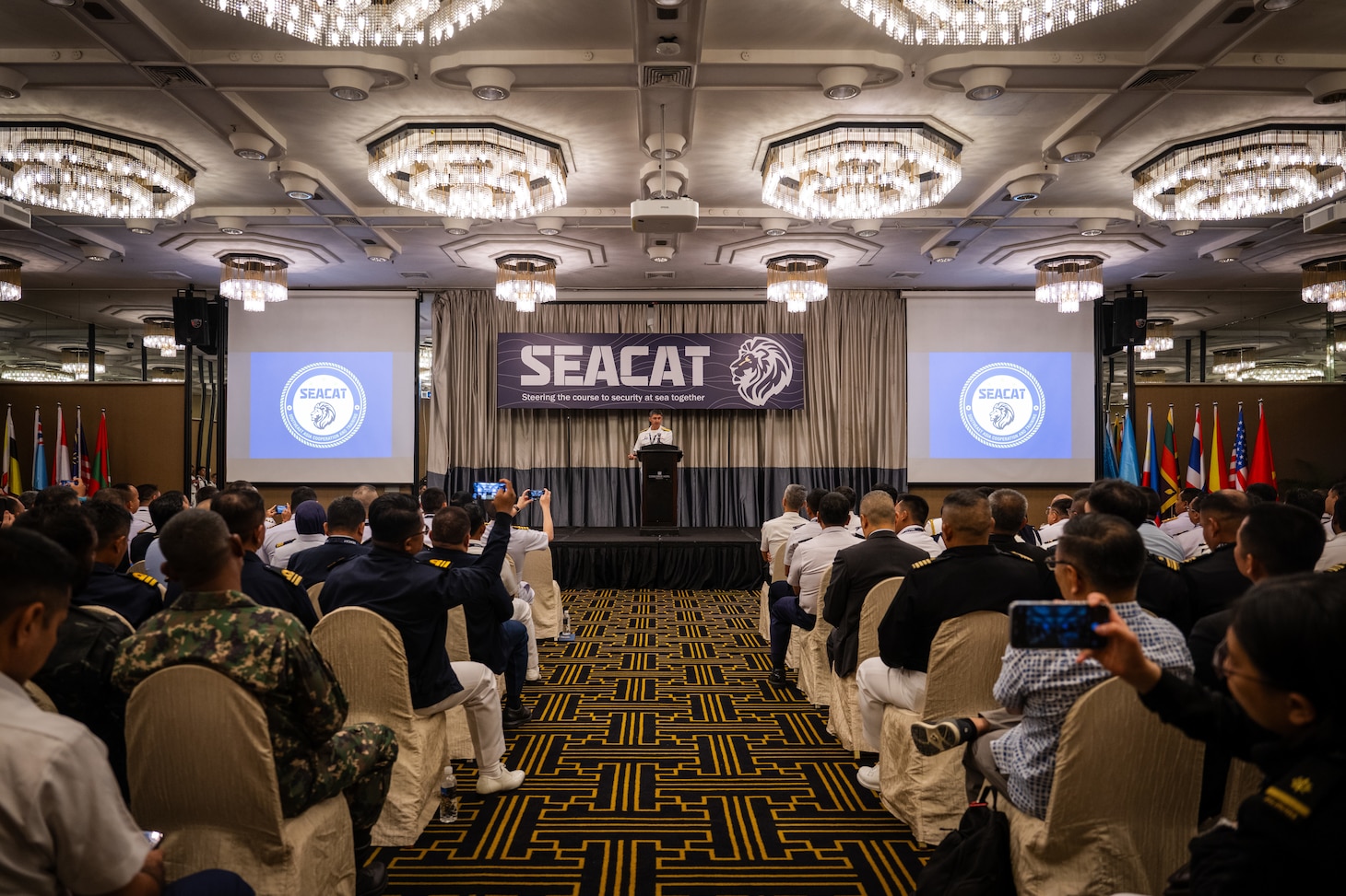 SINGAPORE (Aug. 5, 2025) Rear Adm. Todd Cimicata, commander, Logistics Group Western Pacific/Task Force 73, gives remarks during the opening ceremony of Southeast Asia Cooperation and Training (SEACAT) in Singapore, Aug 5, 2025. SEACAT is a multilateral, multi-platform exercise including ashore and at-sea training evolutions emphasizing real-world engagements to enhance cooperation and maritime security capabilities in the Indo-Pacific. (U.S. Navy Photo by Mass Communications Specialist 2nd Class Jordan Jennings)
