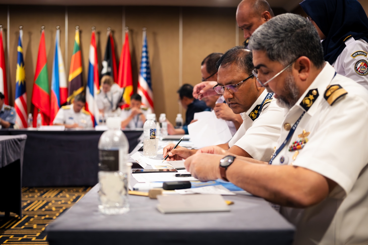 SINGAPORE (Aug. 6, 2025) Leadership from the Bangladesh Navy participate in a senior leader tabletop exercise during Southeast Asia Cooperation and Training (SEACAT) in Singapore, Aug. 6, 2025. SEACAT is a multilateral, multi-platform exercise including ashore and at-sea training evolutions emphasizing real-world engagements to enhance cooperation and maritime security capabilities in the Indo-Pacific. (U.S. Navy Photo by Mass Communications Specialist 2nd Class Jordan Jennings)