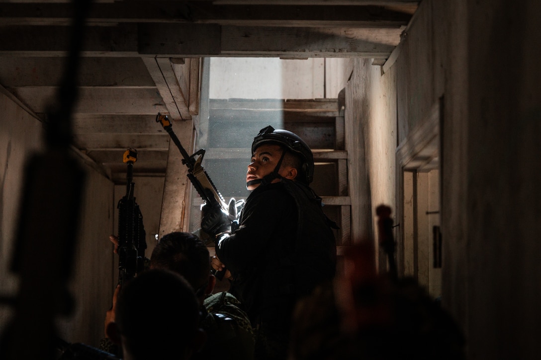 A marine with Infantería de Marina (marine infantry) of Honduras conducts urban operations training as part of exercise UNITAS 2025 at Marine Corps Base Camp Lejeune, North Carolina, Sept. 19, 2025. UNITAS, which is Latin for “unity,” was conceived in 1959 and has taken place annually since first conducted in 1960. This marks the 66th iteration of the world’s longest running annual multinational maritime exercise. (U.S. Marine Corps photo by Cpl. Osmar VasquezHernandez)