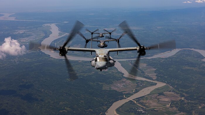 An MV-22B Osprey assigned to Marine Medium Tiltrotor Squadron (VMM) 363, Marine Rotational Force - Darwin 25.3, flies in a formation flight with CV-22 Ospreys assigned to 21st Special Operations Squadron, 353rd Special Operations Wing, near Lal-lo, Philippines, during a foreign disaster relief operation, Aug. 3, 2025. At the request of the Government of the Philippines, the MRF-D 25.3 Marine Air-Ground Task Force is working alongside the Armed Forces of the Philippines to provide foreign disaster relief to communities affected by consecutive storms and the southwest monsoon. The forward presence and ready posture of United States Indo-Pacific Command in the region facilitates rapid and effective response to crisis, demonstrating the U.S.’s commitment to Allies and partners during times of need. MRF-D is an annual six-month rotational deployment to enhance interoperability with the Australian Defence Force and allies and partners and provide a forward postured crisis response force in the Indo-Pacific. (U.S. Marine Corps photo by Cpl. Angelina Sara)