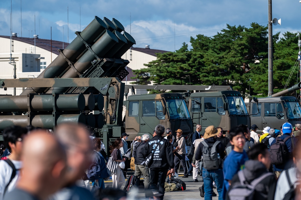 Guests walk in front of Japan Ground Self-Defense Force equipment on display during Air Fest 2025 at Misawa Air Base, Japan, Sept. 21, 2025.