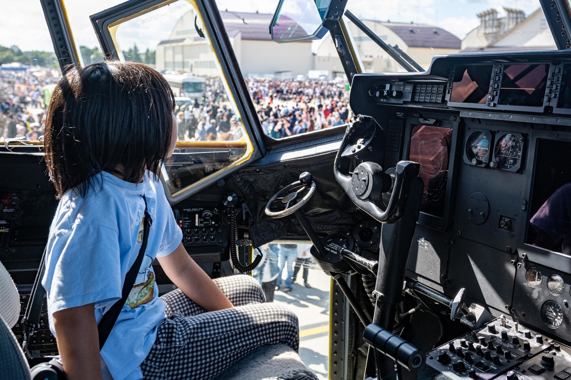 A participant sits in the cockpit of an HC-130J Super Hercules during Air Fest 2025 at Misawa Air Base, Japan, Sept. 21, 2025.